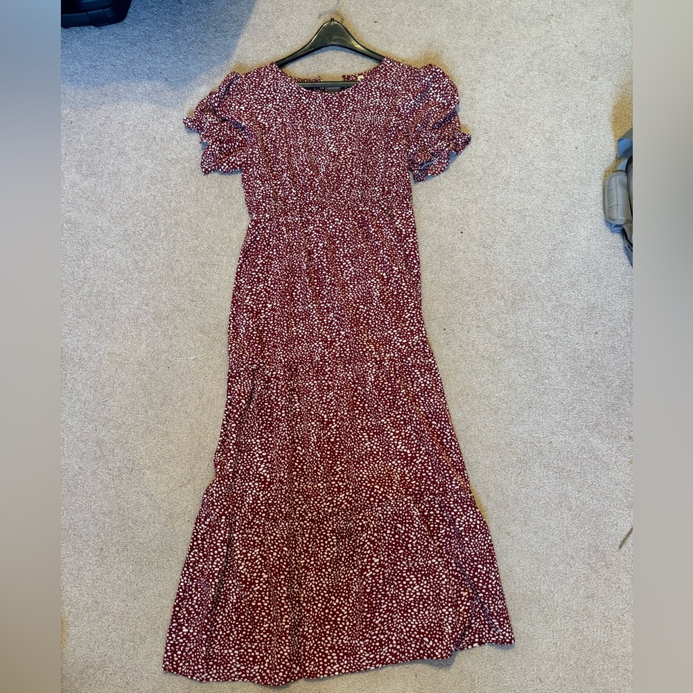 Maroon with white “spots”, almost floor length dress with sleeves